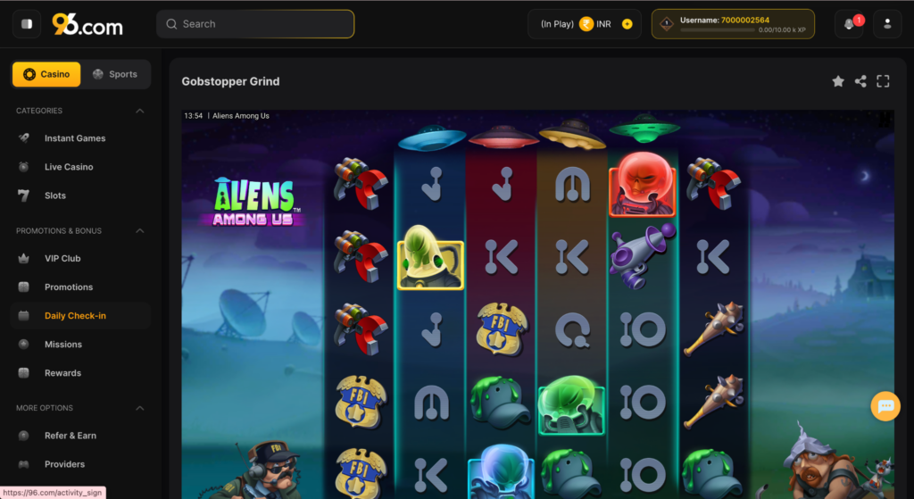 image - Screenshot from 999.com showing the Gobstopper Grind slot game with alien-themed reels and icons like UFOs and FBI badges on a night sky background.